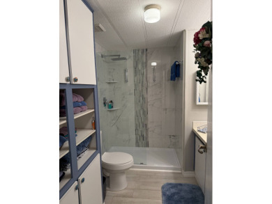 This lovely, manufacture home is on leased land in Lake Fairways on Pine Lakes Country Club in Florida - for sale on GolfHomes.com, golf home, golf lot