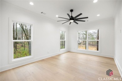 Relax and gaze upon the peaceful water view of this interior on Harbor Club Golf and Country Club in Georgia - for sale on GolfHomes.com, golf home, golf lot