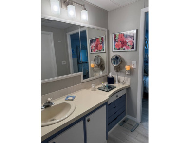 This lovely, manufacture home is on leased land in Lake Fairways on Pine Lakes Country Club in Florida - for sale on GolfHomes.com, golf home, golf lot