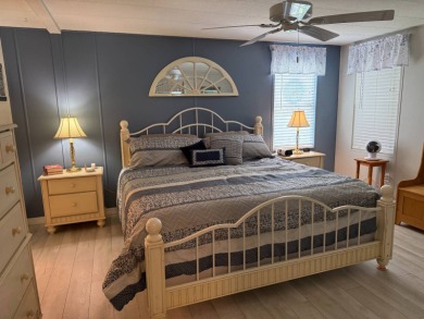 This lovely, manufacture home is on leased land in Lake Fairways on Pine Lakes Country Club in Florida - for sale on GolfHomes.com, golf home, golf lot