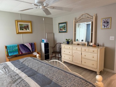 This lovely, manufacture home is on leased land in Lake Fairways on Pine Lakes Country Club in Florida - for sale on GolfHomes.com, golf home, golf lot