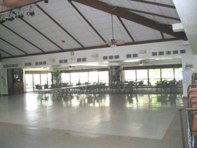 This lovely, manufacture home is on leased land in Lake Fairways on Pine Lakes Country Club in Florida - for sale on GolfHomes.com, golf home, golf lot