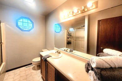 This beautifully maintained 4-bedroom, 2-bath tri-level home is on Lakes of the Four Seasons Country Club in Indiana - for sale on GolfHomes.com, golf home, golf lot