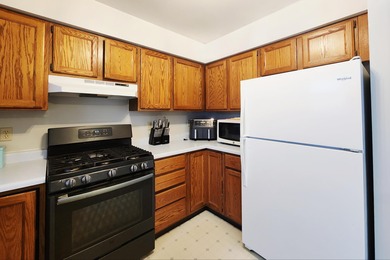 This beautifully maintained 4-bedroom, 2-bath tri-level home is on Lakes of the Four Seasons Country Club in Indiana - for sale on GolfHomes.com, golf home, golf lot