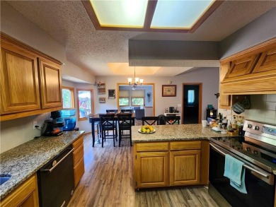 Welcome to this inviting Bella Vista corner-lot home designed on Bella Vista - Metfield Golf Complex and Country Club in Arkansas - for sale on GolfHomes.com, golf home, golf lot