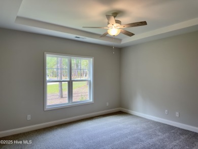 Welcome to your dream home! This stunning 2,352 square foot on Woodlake Country Club in North Carolina - for sale on GolfHomes.com, golf home, golf lot