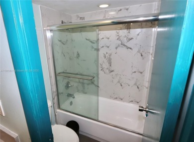 STUNNINGLY RENOVATED MODERN 2B/R 2B/A WITH DIRECT GOLF COURSE & on Turnberry Isle Resort and Club in Florida - for sale on GolfHomes.com, golf home, golf lot