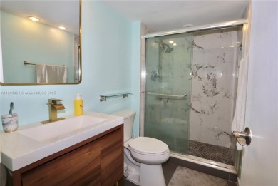 STUNNINGLY RENOVATED MODERN 2B/R 2B/A WITH DIRECT GOLF COURSE & on Turnberry Isle Resort and Club in Florida - for sale on GolfHomes.com, golf home, golf lot