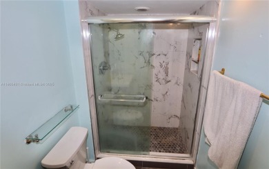 STUNNINGLY RENOVATED MODERN 2B/R 2B/A WITH DIRECT GOLF COURSE & on Turnberry Isle Resort and Club in Florida - for sale on GolfHomes.com, golf home, golf lot