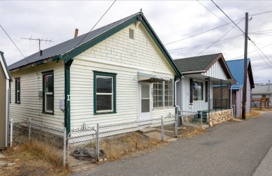 Built in 1906, this charming turn of the century home on E Front on The Old Works Golf Course in Montana - for sale on GolfHomes.com, golf home, golf lot