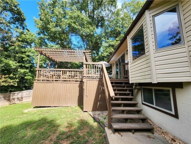 Welcome to this inviting Bella Vista corner-lot home designed on Bella Vista - Metfield Golf Complex and Country Club in Arkansas - for sale on GolfHomes.com, golf home, golf lot