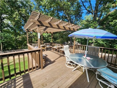Welcome to this inviting Bella Vista corner-lot home designed on Bella Vista - Metfield Golf Complex and Country Club in Arkansas - for sale on GolfHomes.com, golf home, golf lot