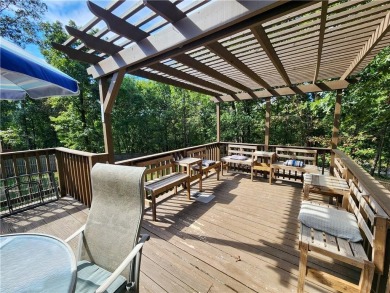 Welcome to this inviting Bella Vista corner-lot home designed on Bella Vista - Metfield Golf Complex and Country Club in Arkansas - for sale on GolfHomes.com, golf home, golf lot