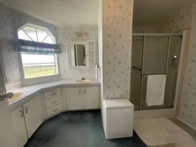 NEW REDUCED PRICE ~ $89,900! Located adjacent to a Florida on Four Lakes Golf Club in Florida - for sale on GolfHomes.com, golf home, golf lot