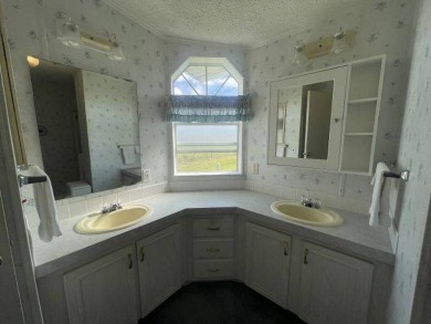 NEW REDUCED PRICE ~ $89,900! Located adjacent to a Florida on Four Lakes Golf Club in Florida - for sale on GolfHomes.com, golf home, golf lot