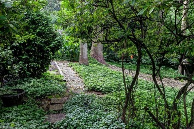 Tucked on a quiet, tree-lined street in Kingsmill, this on Kingsmill Resort and Golf Club in Virginia - for sale on GolfHomes.com, golf home, golf lot