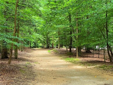 Tucked on a quiet, tree-lined street in Kingsmill, this on Kingsmill Resort and Golf Club in Virginia - for sale on GolfHomes.com, golf home, golf lot