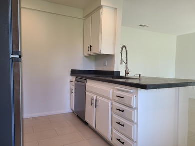 Welcome to this inviting two-bedroom, one-bath end unit condo on Indian Palms Country Club and Resort in California - for sale on GolfHomes.com, golf home, golf lot