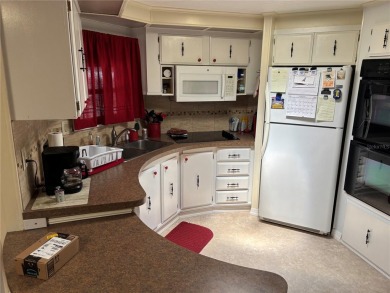 Move-in ready home in a desirable 55+ golf community overlooking on Zellwood Station Country Club in Florida - for sale on GolfHomes.com, golf home, golf lot