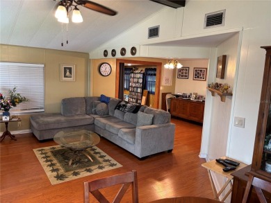 Move-in ready home in a desirable 55+ golf community overlooking on Zellwood Station Country Club in Florida - for sale on GolfHomes.com, golf home, golf lot