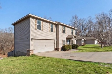 Welcome to this update 1,480 square foot home in the wooded on Bella Vista - Metfield Golf Complex and Country Club in Arkansas - for sale on GolfHomes.com, golf home, golf lot