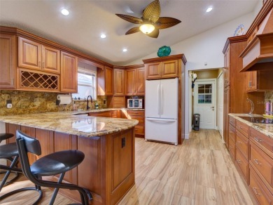 This meticulously-kept custom home offers an oversized custom on Plantation Golf Club in Florida - for sale on GolfHomes.com, golf home, golf lot