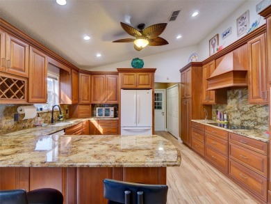 This meticulously-kept custom home offers an oversized custom on Plantation Golf Club in Florida - for sale on GolfHomes.com, golf home, golf lot