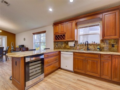 This meticulously-kept custom home offers an oversized custom on Plantation Golf Club in Florida - for sale on GolfHomes.com, golf home, golf lot