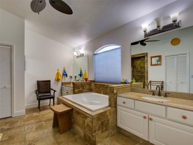 This meticulously-kept custom home offers an oversized custom on Plantation Golf Club in Florida - for sale on GolfHomes.com, golf home, golf lot