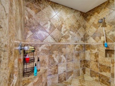 This meticulously-kept custom home offers an oversized custom on Plantation Golf Club in Florida - for sale on GolfHomes.com, golf home, golf lot