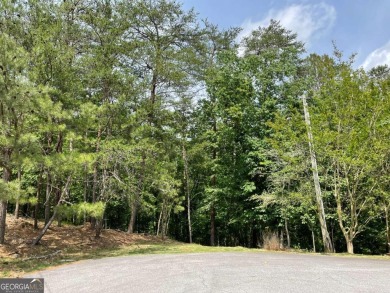 This beautiful wooded lot in the prestigious Lake Arrowhead on The Highlands Course at Lake Arrowhead in Georgia - for sale on GolfHomes.com, golf home, golf lot