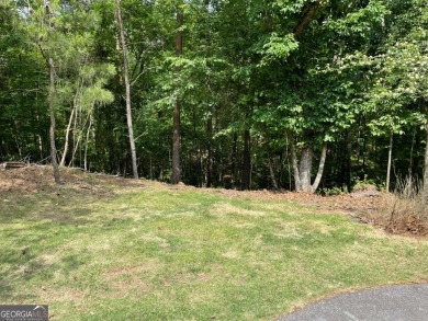 This beautiful wooded lot in the prestigious Lake Arrowhead on The Highlands Course at Lake Arrowhead in Georgia - for sale on GolfHomes.com, golf home, golf lot