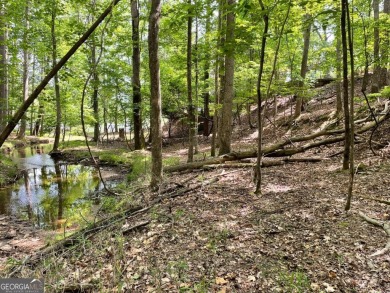 This beautiful wooded lot in the prestigious Lake Arrowhead on The Highlands Course at Lake Arrowhead in Georgia - for sale on GolfHomes.com, golf home, golf lot