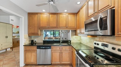 Lakefront villa that lives like a home, but without the hassle on The Meadows Golf and Country Club in Florida - for sale on GolfHomes.com, golf home, golf lot