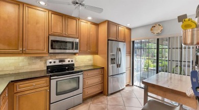 Lakefront villa that lives like a home, but without the hassle on The Meadows Golf and Country Club in Florida - for sale on GolfHomes.com, golf home, golf lot