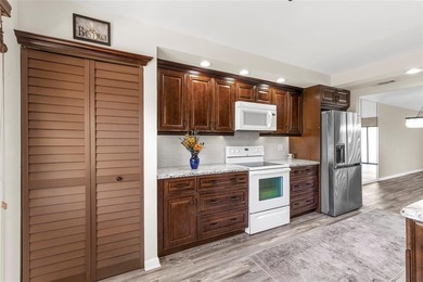 PRICED TO SELL! Spacious IRIS 2 bed 2 bath model lovingly on Wynmoor Golf Course in Florida - for sale on GolfHomes.com, golf home, golf lot