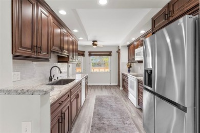 PRICED TO SELL! Spacious IRIS 2 bed 2 bath model lovingly on Wynmoor Golf Course in Florida - for sale on GolfHomes.com, golf home, golf lot