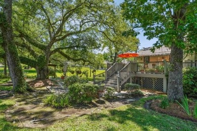 Lovely raised Acadian cottage on an oversized lot fronting the on Covington Country Club in Louisiana - for sale on GolfHomes.com, golf home, golf lot