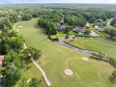 Nestled on a picturesque half-acre lot on the desirable Oak on Oak Grove Island Golf and Country Club in Georgia - for sale on GolfHomes.com, golf home, golf lot