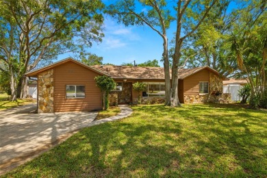 This spacious home with circle drive and fenced yard has plenty on Pinecrest Golf Club in Florida - for sale on GolfHomes.com, golf home, golf lot