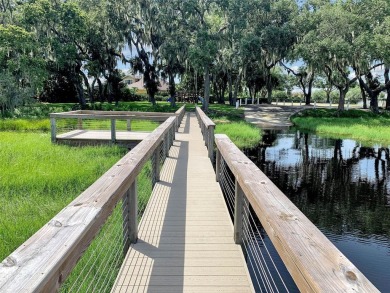 Welcome to your dream retreat! Savor the 180? sunset view every on Palisades Country Club in Florida - for sale on GolfHomes.com, golf home, golf lot