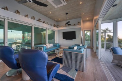 Custom home on 150 ft of waterfront for the sporting enthusiast on Gasparilla Inn Golf Course in Florida - for sale on GolfHomes.com, golf home, golf lot