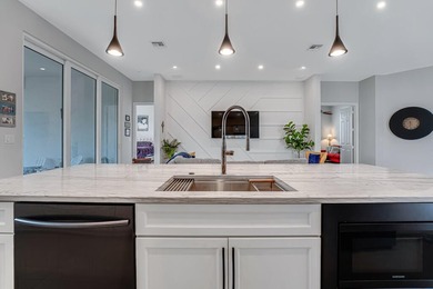 This beautiful open concept renovated home is one you will not on Fountains Golf and Country Club in Florida - for sale on GolfHomes.com, golf home, golf lot