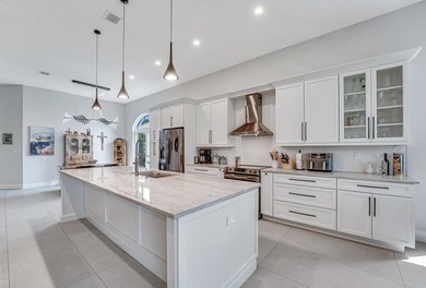 This beautiful open concept renovated home is one you will not on Fountains Golf and Country Club in Florida - for sale on GolfHomes.com, golf home, golf lot