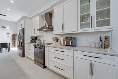 This beautiful open concept renovated home is one you will not on Fountains Golf and Country Club in Florida - for sale on GolfHomes.com, golf home, golf lot