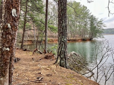 Discover your private woodland retreat with seasonal long-range on The Highlands Course at Lake Arrowhead in Georgia - for sale on GolfHomes.com, golf home, golf lot