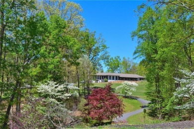 This beautiful, meticulously maintained log home sits on .95 on Bent Tree Golf Course in Georgia - for sale on GolfHomes.com, golf home, golf lot