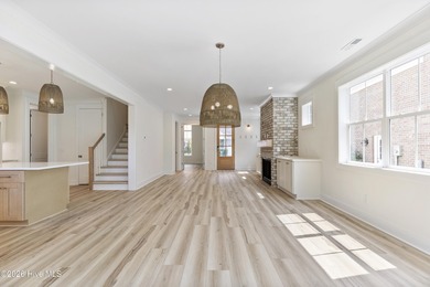 Experience refined coastal living at 387 Blossom Tree Lane SE on Carolina National Golf Club in North Carolina - for sale on GolfHomes.com, golf home, golf lot