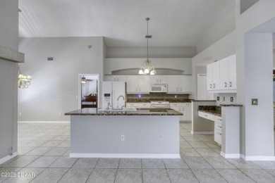 Welcome home to this beautifully maintained 3-bedroom on Plantation Bay Golf and Country Club in Florida - for sale on GolfHomes.com, golf home, golf lot
