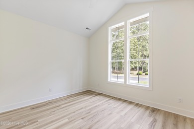 Experience refined coastal living at 387 Blossom Tree Lane SE on Carolina National Golf Club in North Carolina - for sale on GolfHomes.com, golf home, golf lot